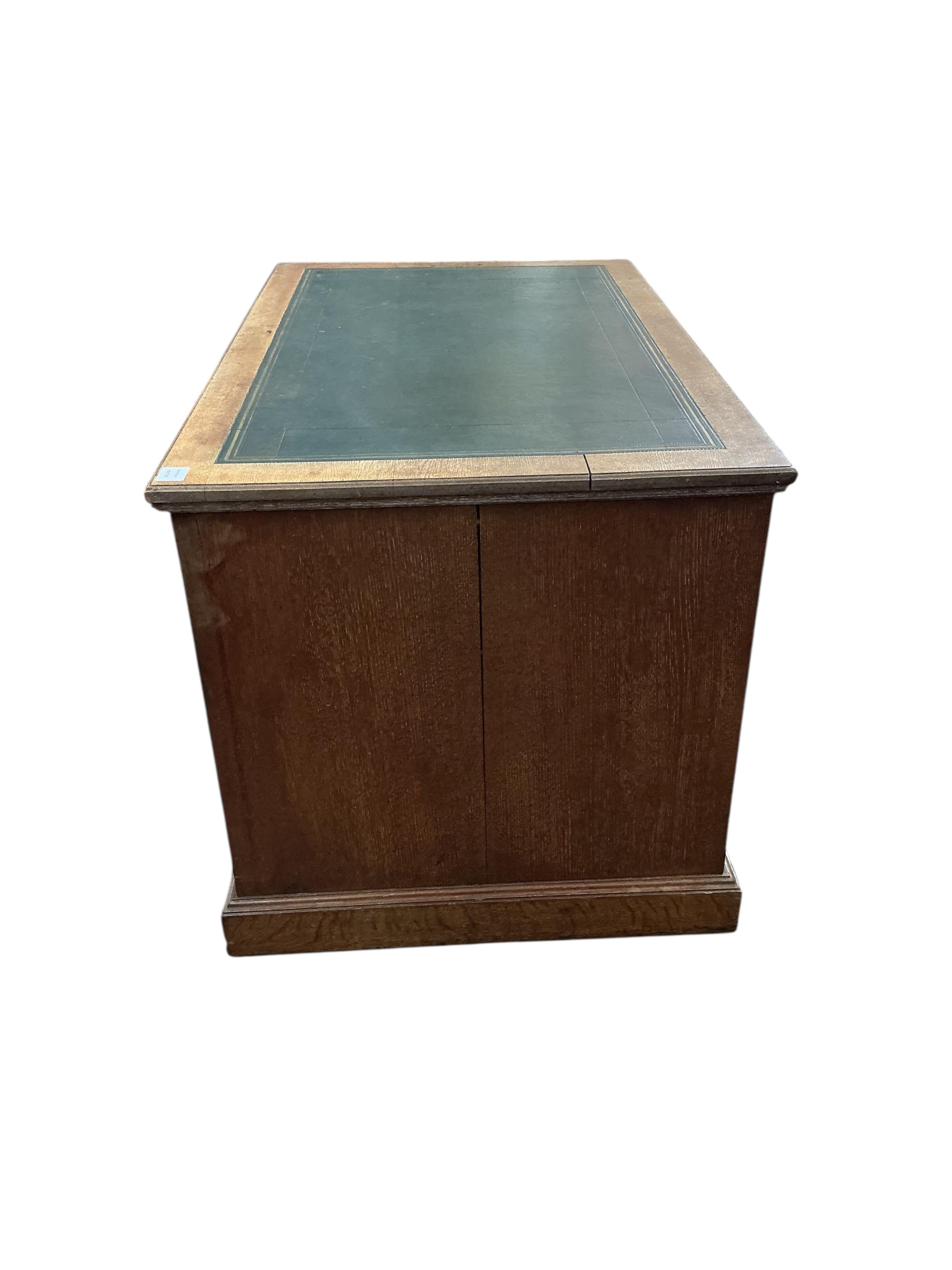A late Victorian oak kneehole desk, width 122cm, depth 76cm, height 76cm
